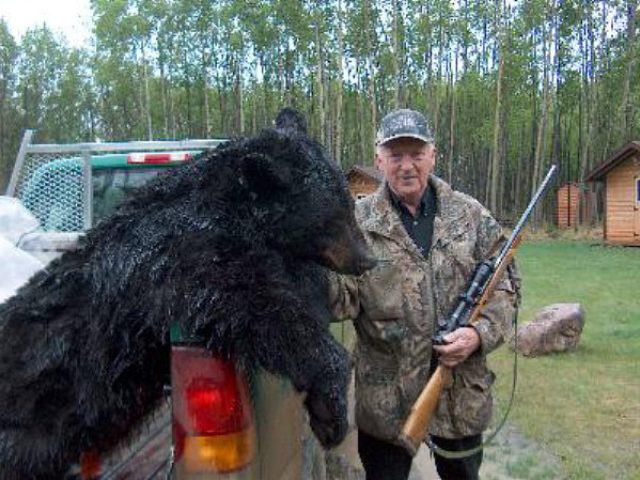 My good friend and many times return client, Kent from Sweden, poses on a rainy day beside this 400 pound black bear. A great trophy and a professional hunter and I look forward to seeing him and his group on each of his trips. Always non-baited hunts for this group. 
