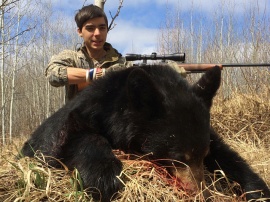 They came together, they hunted together and they each got their 2 bears.  Here is Elijah with his first bear and a fun guy to have in camp.  Like nearly all hunters, Elijah tagged both his bears along with the other members of that early spring spot and stalk black bear hunt.  Congratulations Elijah on your bears and a big thanks from nearly everyone in camp to your assistance in teaching so many how to work cell phones.  lol.