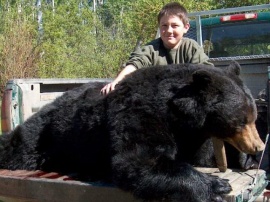 Our youngest hunter ever, twelve year old, Alex, with his monster archery bear. His shot intercepted this 500 pound bruin when he was coming for his daily feeding of clover. Clover and grasses are a favourite food for spring and fall bear and an easy way to hunt non-baited bear.