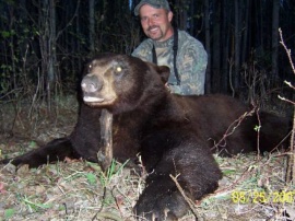An active member of his states turkey association, Ron tagged this dark chocolate brown bear on his non baited hunt. This professional hunter wanted the best and he received one of the best of the bears. This huge brown made the mistake of getting into Ron's sights and one shot brought down this wonderful trophy.