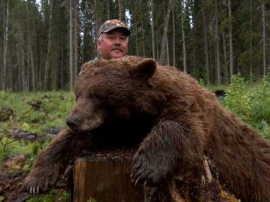 Todd with another huge bear taken on a non-baited hunt. The best of the hunting methods for huge bear.
