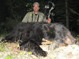 Rick showed up in camp ready for an exciting bear hunt. He wanted a real bear hunt, a spot and stalk. He saw many, many bears and chose his two trophies carefully. Armed with both rifle and bow he took his first with his rifle but his second bear was taken after a perfect 500 yard stalk and a straight arrow at just over 30 yards. His spot and stalk archery hunt produced him a 350 pound black bear.