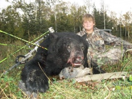 Nate, hunting at 12 years of age and he took home two bears. His first with a rifle and his second he pocked 3 arrows into this bear at 22 yards hitting the bear in the spine and neck bone. The bear dropped from his first arrow, the others arrows were reassurance of his bear on the ground. Fantastic shooting. What a pleasure to have Nate in camp. He is a great hunter and will be greater in the years to come.