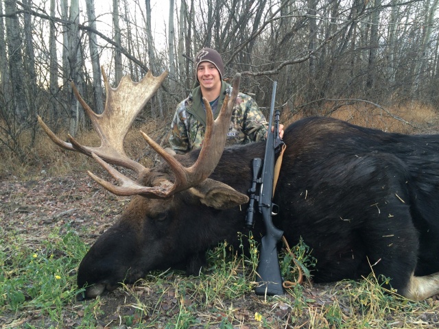 My grandson, Rylan, with his first bull moose....