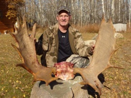 Mark, a return hunter and just an all around good guy has taken bear and moose from my camp on different hunts. This coming spring season he is planning for another bear. This last fall he tagged this excellent monster bull with 10 points on each side. What a great trophy it will make for his trophy room. I enjoy his company each time he comes. So nice to have return clients too.
