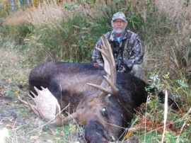 My guide who has been with me for a great many years holds a 48 inch bull with well balanced antlers. He is also a trapper so very knowledgeable about the forest and the animals he guides for. He is a first class guide/hunter who cares more about getting your trophy than you do. The best anywhere.