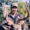 Sean displays his early season trophy mule deer buck. An exceptionally heavy beamed buck with a 28 inch spread and sporting 6 points per side. Early season hunts are certainly among the best of the year for heavy beams.
